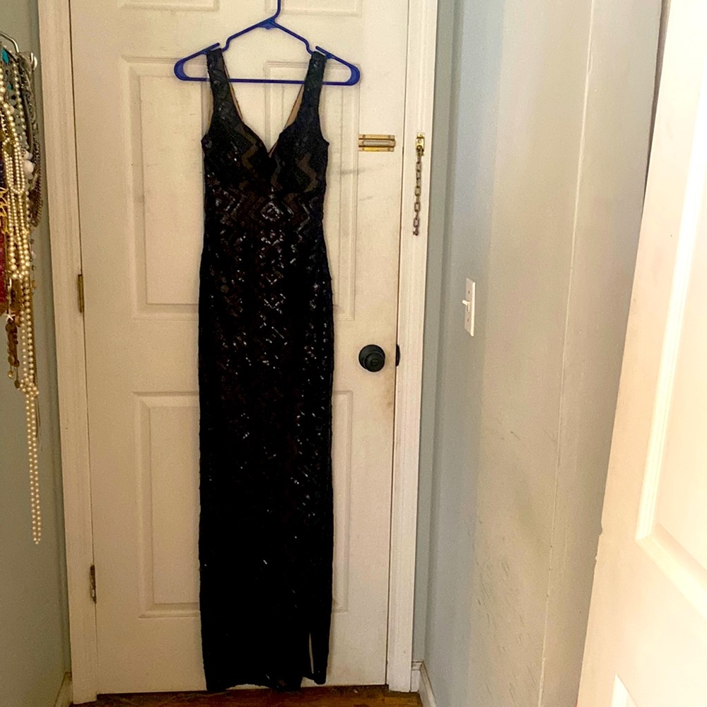 Black sequined long dress with high slit.  Deep V in front.